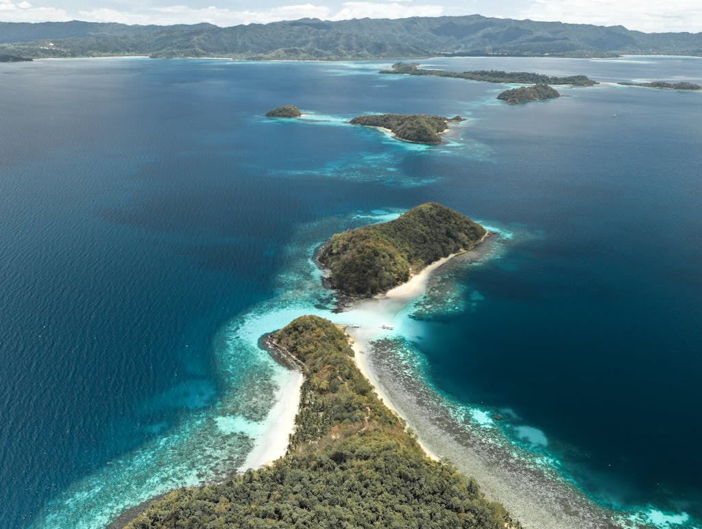 Stunning aerial view of tropical islands in the clear blue waters of MIMAROPA, Philippines.